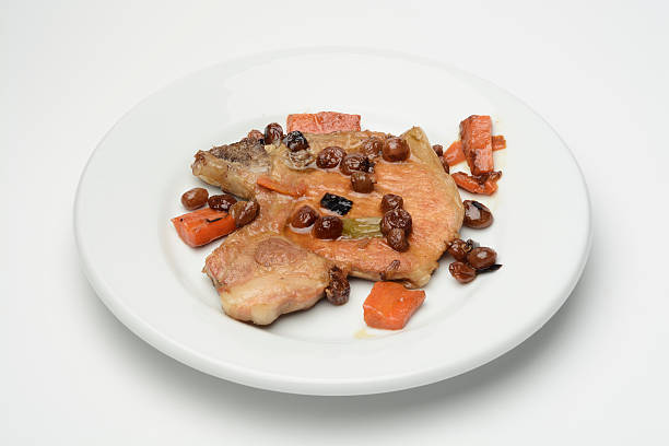 istock Pork steak and vegetables cooked with raisins 528624330