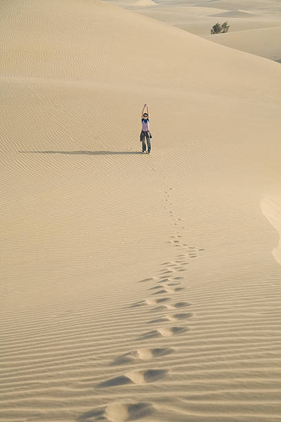 istock woman greeting from the desert 528625978