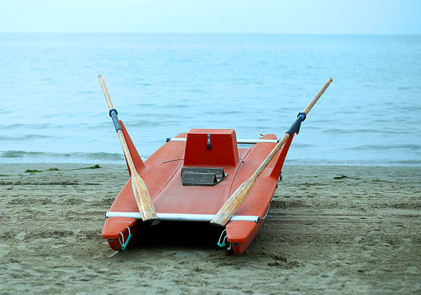 istock rescue boat rowing for lifeguard on the shore 528626636