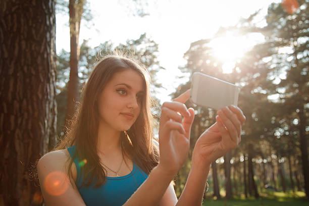 istock Pretty girl taking a selfie on a sunny afternoon 528627804
