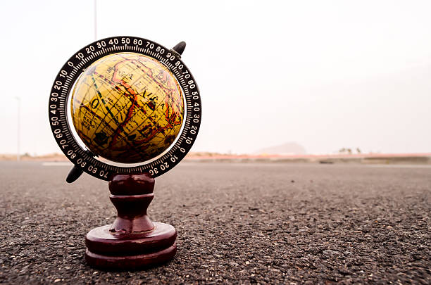 istock Globe Earth on an Asphalt Street 528630678