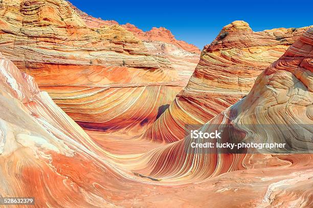 The Wave Plateau From Red Sandstone In Form Ocean Waves Stock Photo - Download Image Now