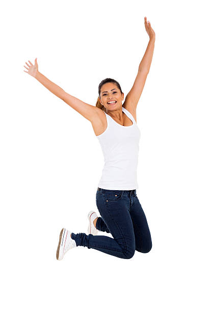 istock excited young woman jumping 528633397