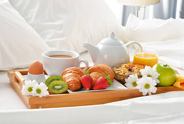 istock Breakfast tray in bed in hotel room 528633806