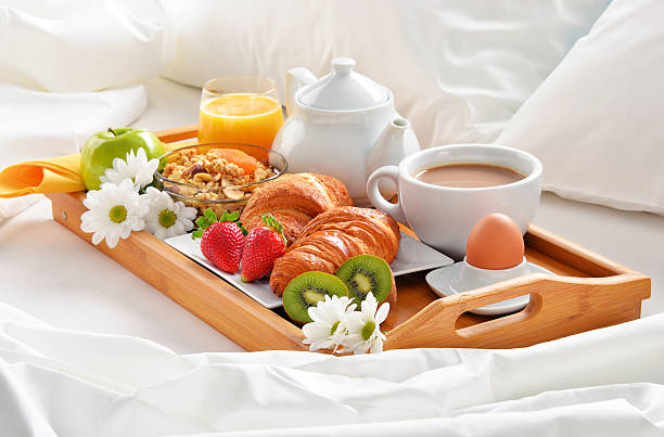 istock Breakfast tray in bed in hotel room 528633968