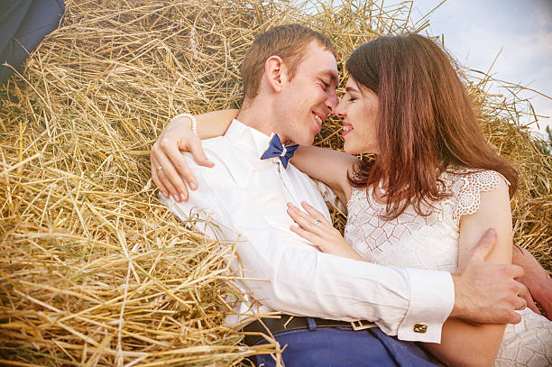 istock Couple at rural haystacks 528634232