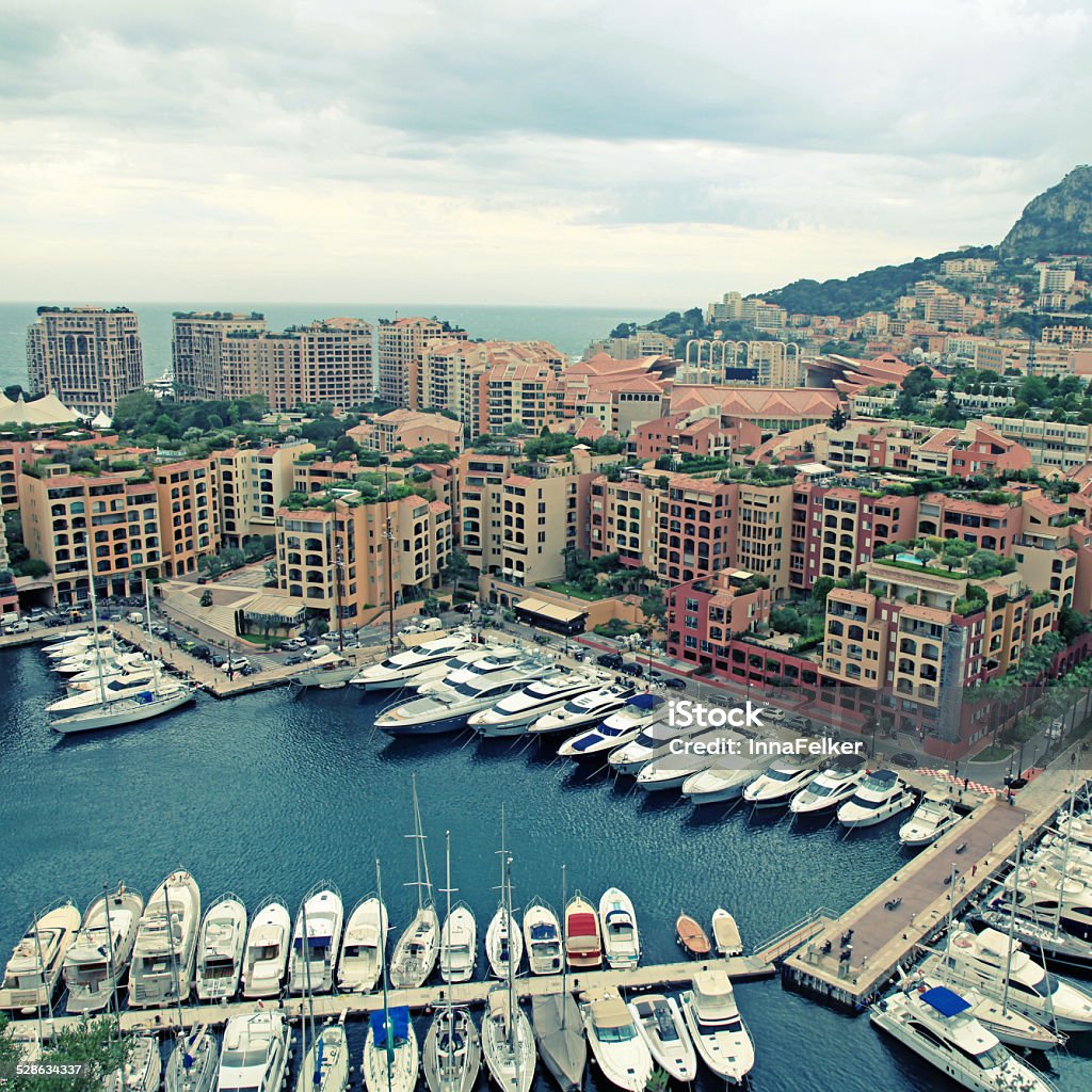 yacht pier in Monte Carlo, French Riviera Panoramic landscape with harbor, lots of yachts in famous Monte Carlo, Cote d'Azur. square toned image Apartment Stock Photo