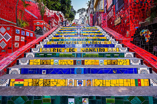 Selaron Staircase, Rio de Janeiro, Brazil Rio de Janeiro, Brazil - October 2, 2012: View of Lapa Steps, also known as Selaron's Staircase, in Rio de Janeiro, Brazil. The colourful tiled staircase is the most famous work of Chilean-born artist Jorge Selaron. favela stock pictures, royalty-free photos & images