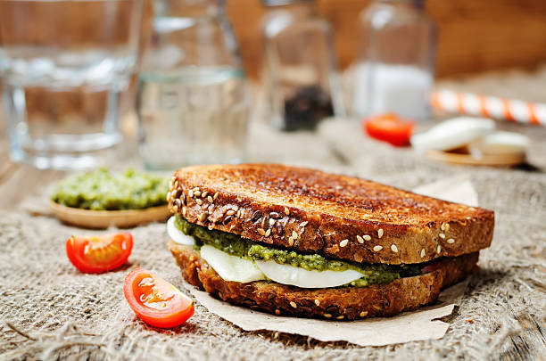 istock Pesto Mozzarella tomatoes grilled rye sandwich 528634992