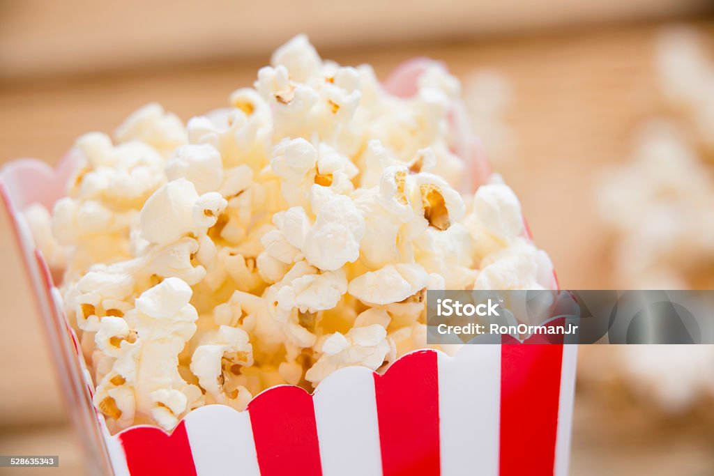 Popcorn This is a shot of popcorn in a box ready to be eaten. Shot with a shallow depth of field. Box - Container Stock Photo