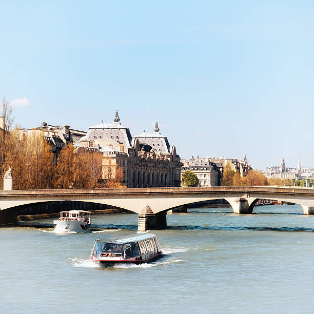 istock Autumn in Paris, river boats going up Seine river, 528635962