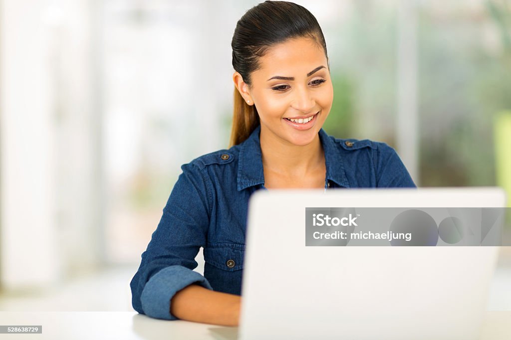 college student using laptop computer happy college student using laptop computer Adult Stock Photo