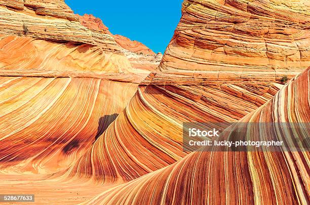 The Wave Plateau From Red Sandstone In Form Ocean Waves Stock Photo - Download Image Now