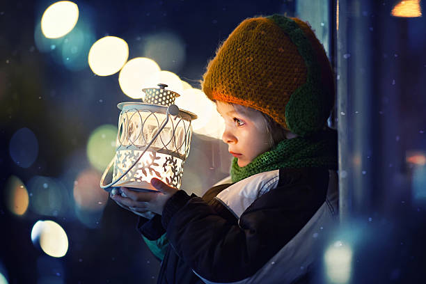 istock Cute boy, holding lantern outdoor 528677741