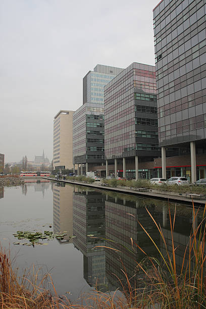 istock Office centre with park and fish-stocked lake. 528677907