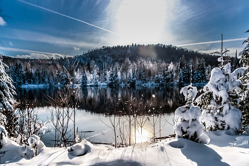 winter scene abroad a lake in rural country of Mont-Tremblant, Quebec, Canada