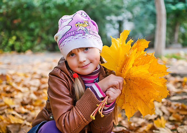 istock little girl in the park 528679617