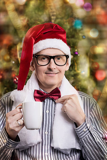 istock young handsome man in Santa caps 528680751