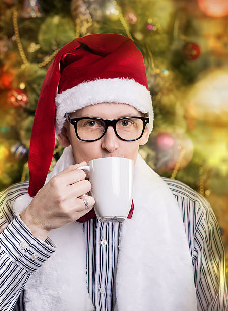 istock young handsome man in Santa caps 528680757