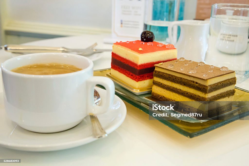 Cakes and coffee Berry cake and tiramisu served with coffee in a restaurant Baked Stock Photo