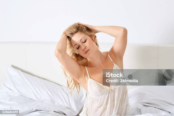 Smiling Woman In Her Bedroom Stock Photo - Download Image Now - Adult, Beautiful People, Beauty