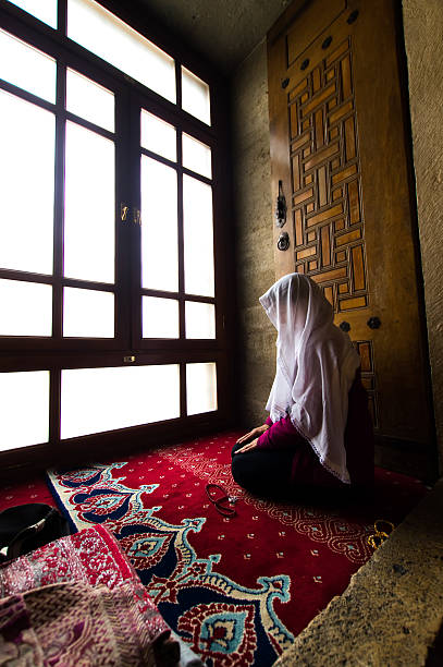 istock woman praying 528684163