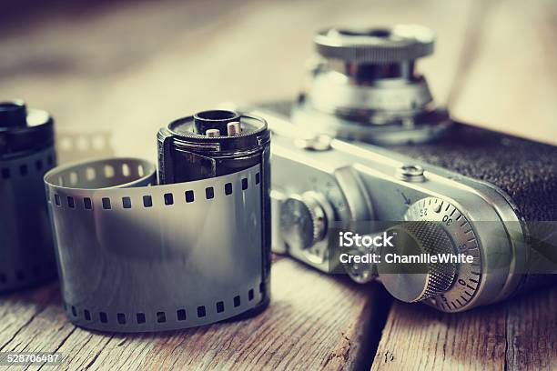 Old Photo Film Rolls Cassette And Retro Camera Selective Focus Stock Photo - Download Image Now