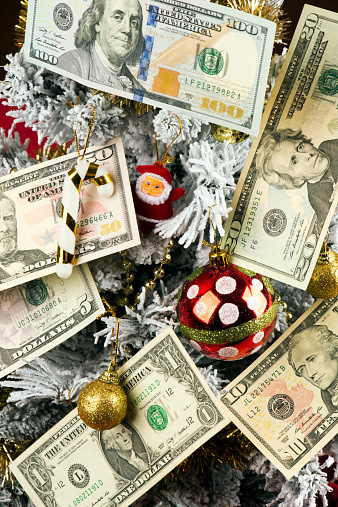American dollars hanging on the Christmas tree