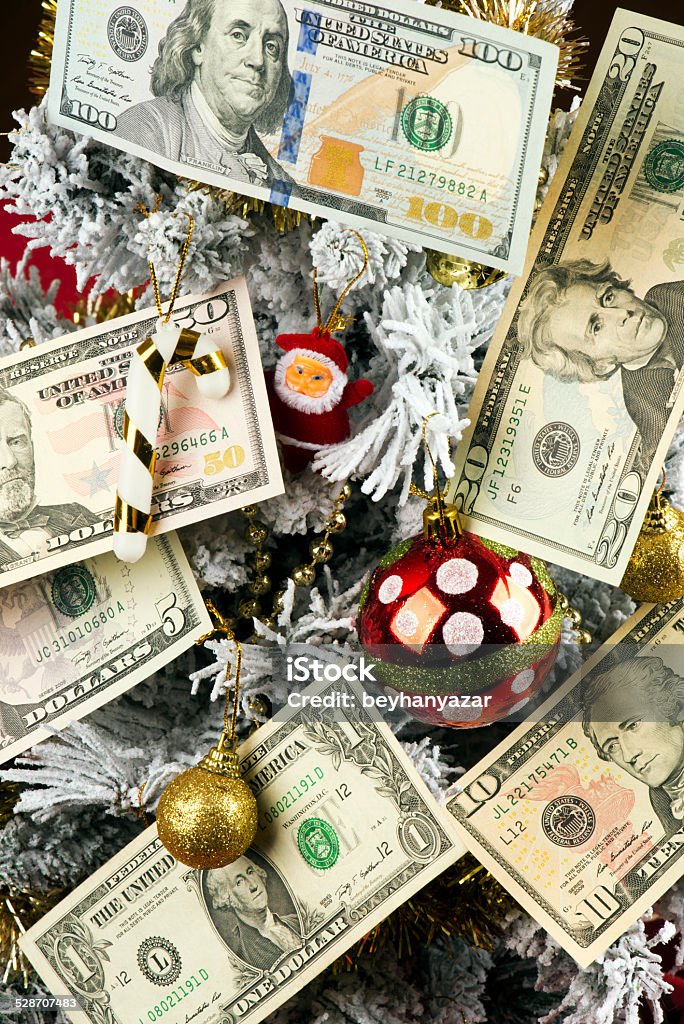 Christmas tree and USA Dollars American dollars hanging on the Christmas tree Christmas Stock Photo