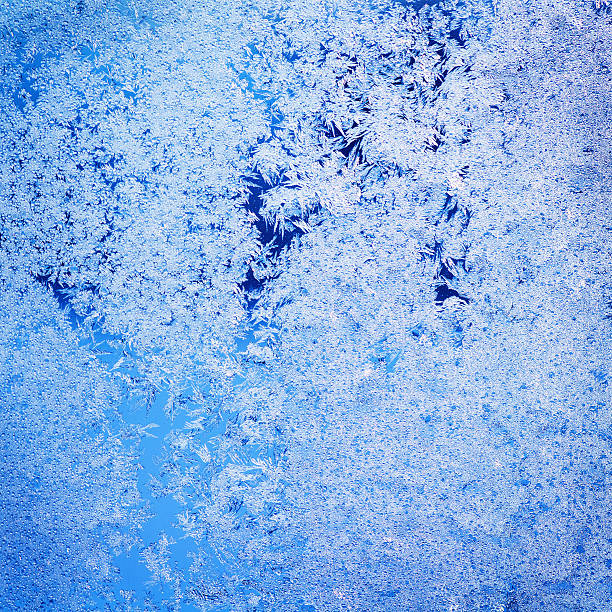 istock texture of patterns on frozen window glass 528707911