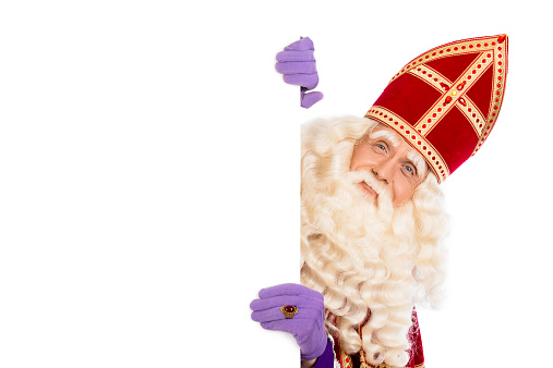 Smiling Sinterklaas with white board. isolated on white background. Dutch character of Santa Claus