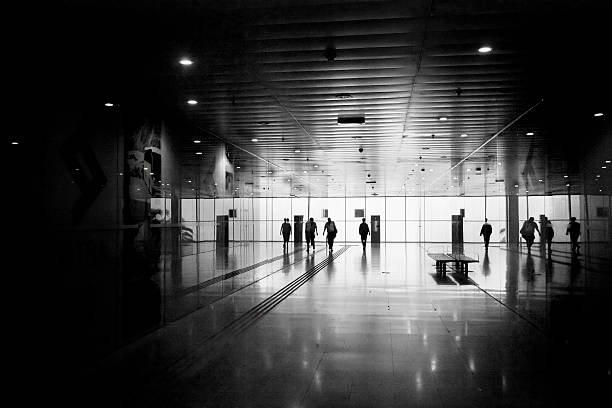 istock People silhouetted in a corridor. 528708723