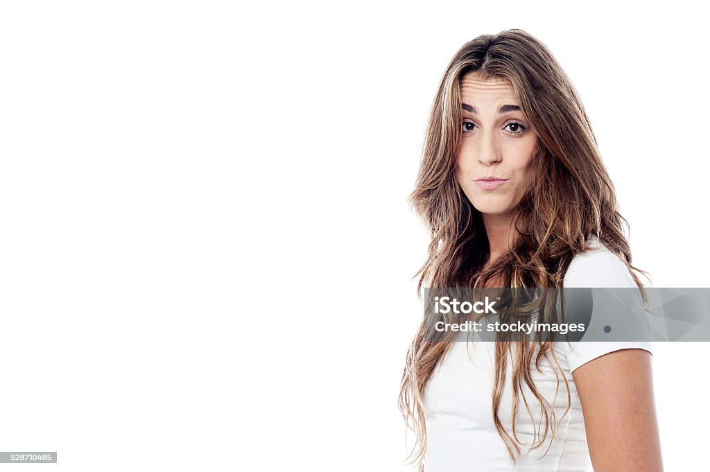 Girl expressive with pursed lips Beautiful girl with funny expression, looking at camera. Adults Only Stock Photo