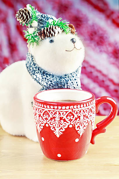 istock Cup of hot cocao with toy bear 528710541