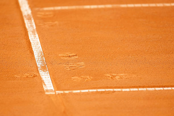 istock Footprints on a tennis clay court 528710769