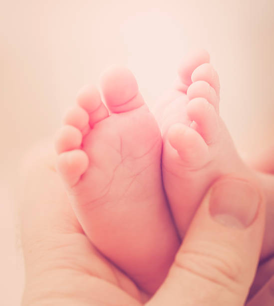 istock Newborn Baby Feet 528711409