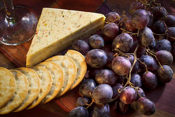 Elegant Appetizer Of Grapes Water Crackers And Cheese