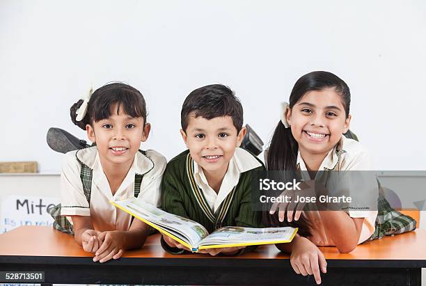 School Kids Reading Books Stock Photo - Download Image Now - Anticipation, Boys, Chalkboard - Visual Aid