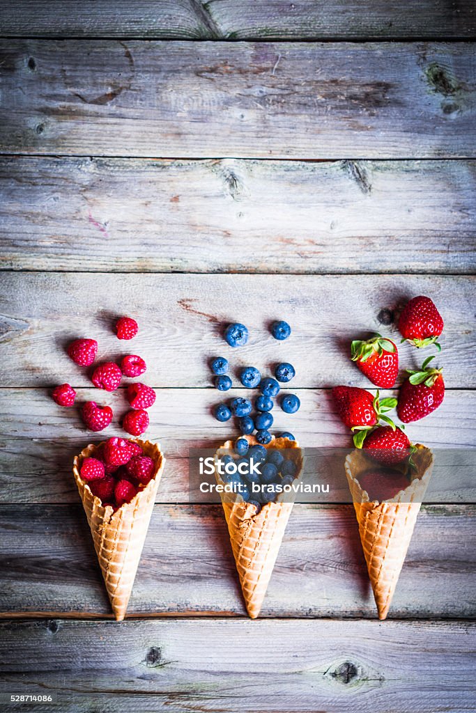 Berries in waffle cones Basket Stock Photo