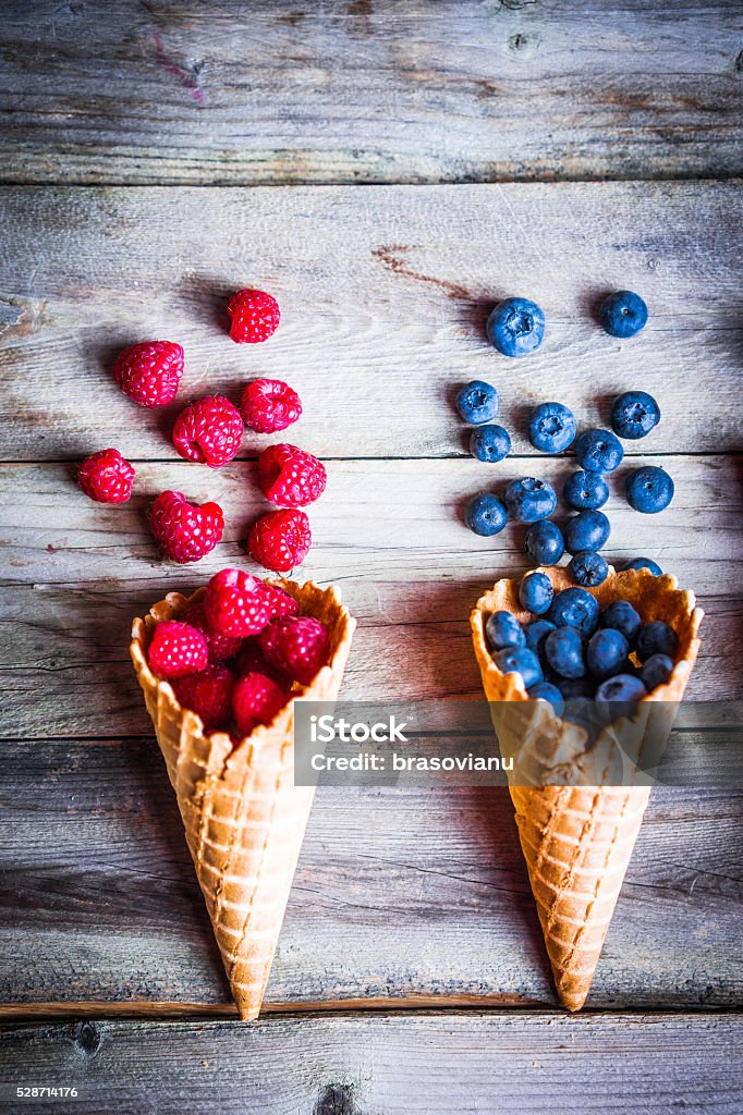 Berries in waffle cones Basket Stock Photo