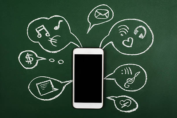istock Hand drawn IT icons on a board with smart phone 528715248