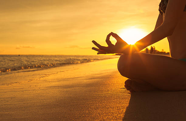 istock Woman doing yoga on the beach 528717676
