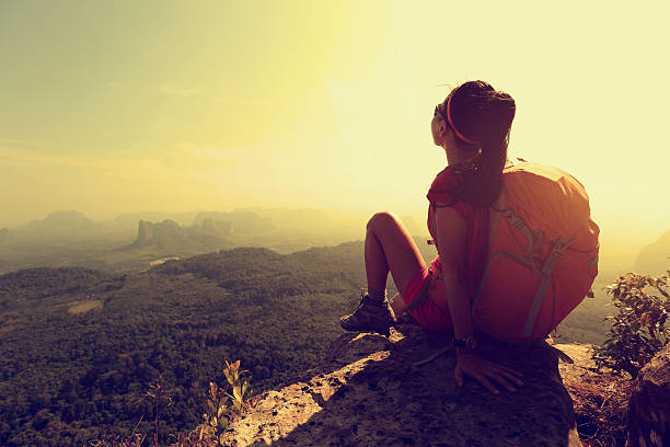 istock successful woman hiker enjoy the view on mountain top 528717792