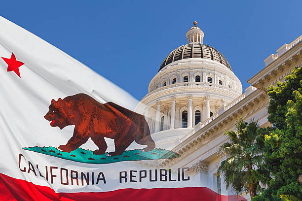 California State Capital with State Flag Sacramento California outside the capital building sacramento stock pictures, royalty-free photos & images