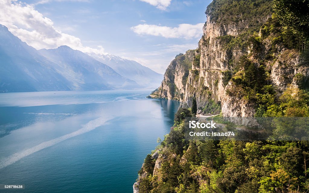 Panorama of the gorgeous Lake Garda surrounded by mountains. Panorama of the gorgeous Lake Garda surrounded by mountains in Riva del Garda, Italy. Lake Garda Stock Photo