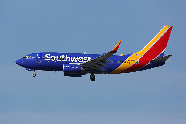 Southwest Airlines Boeing 737-700 airplane Los Angeles International Airport Los Angeles, United States - February 19, 2016: A Southwest Airlines Boeing 737-700 with the registration N910WN landing at Los Angeles International Airport (LAX) in the United States. Southwest Airlines is an American low-cost airline headquartered in Dallas. 737 stock pictures, royalty-free photos & images