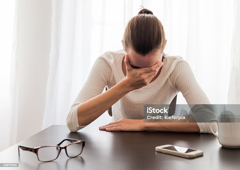 Depressed businesswoman Depressed young businesswoman. One Woman Only Stock Photo