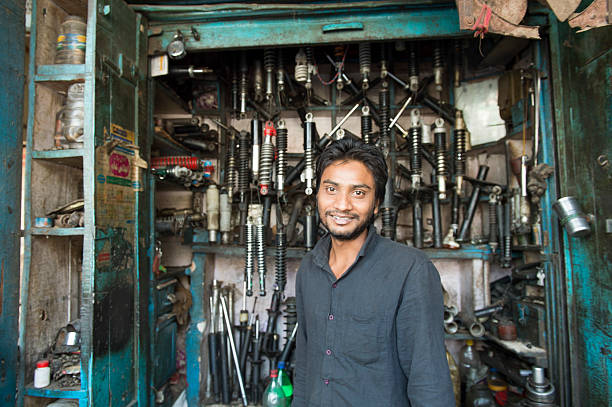 Local Indian mechanic pose for camera stock photo