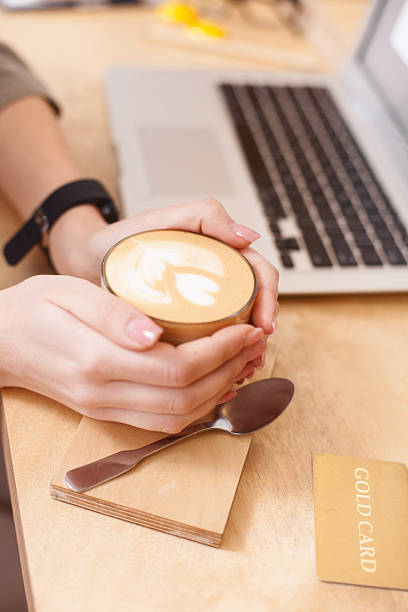 istock Cute young girl is drinking hot coffee 528720724