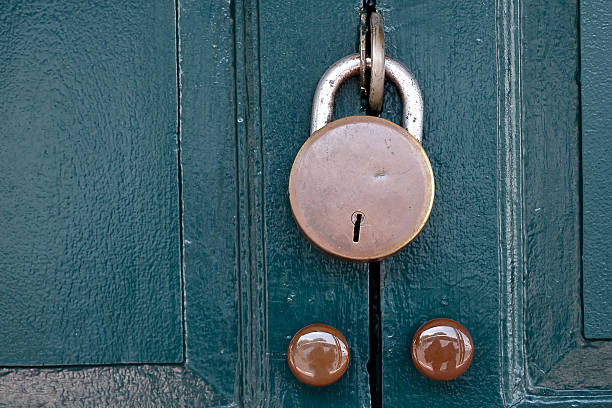 istock Green Retro door with antique padlock 528722848